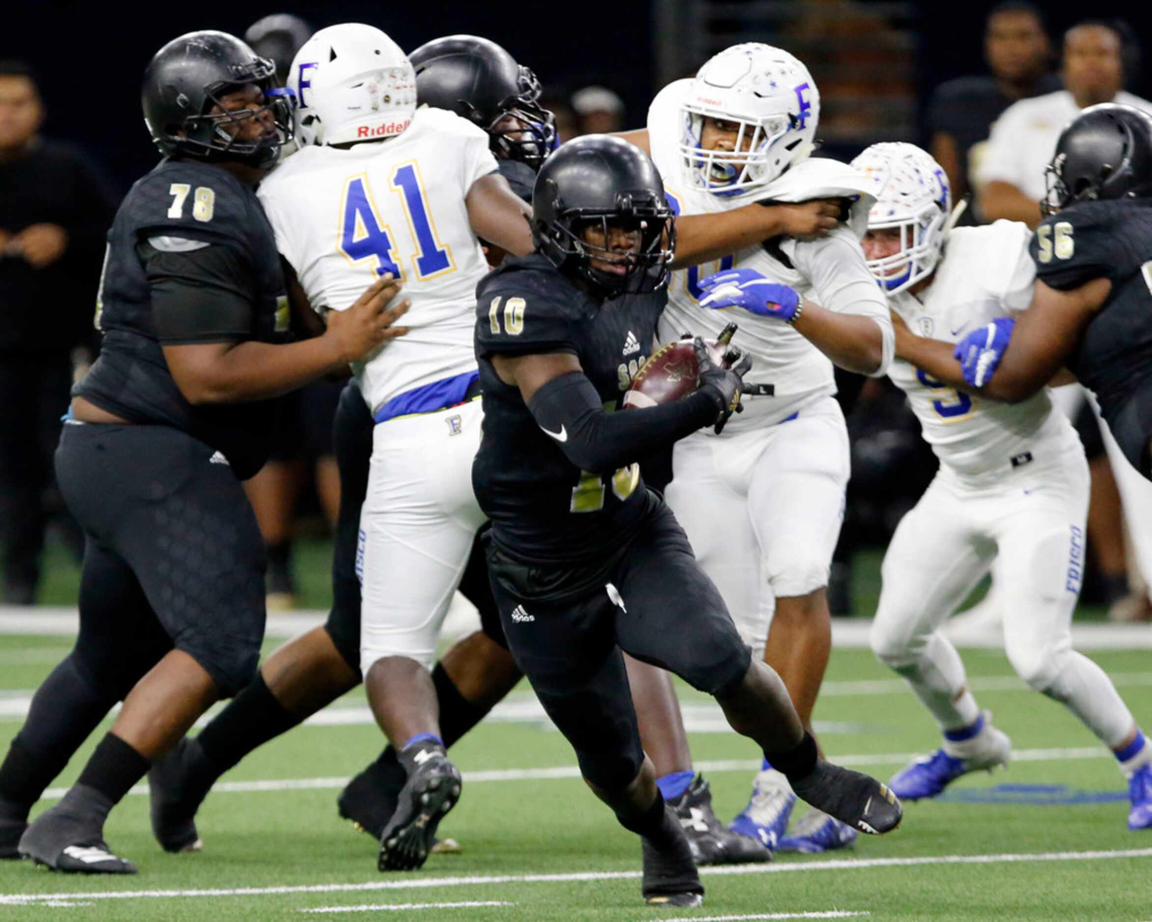 South Oak Cliff Mikeviun Titus (10) breaks loose for a first down during the first half of...