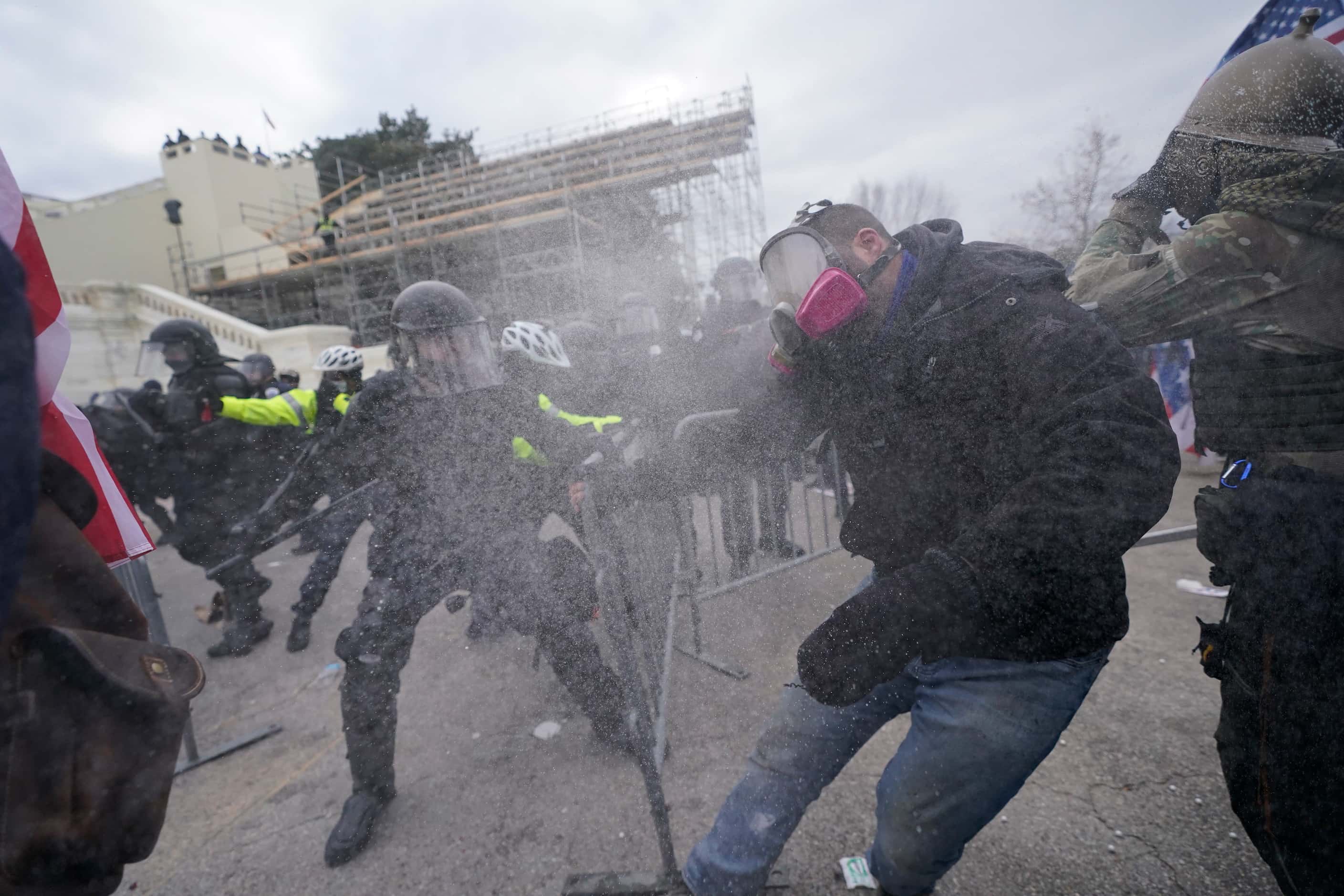 Trump supporters try to break through a police barrier, Wednesday, Jan. 6, 2021, at the...