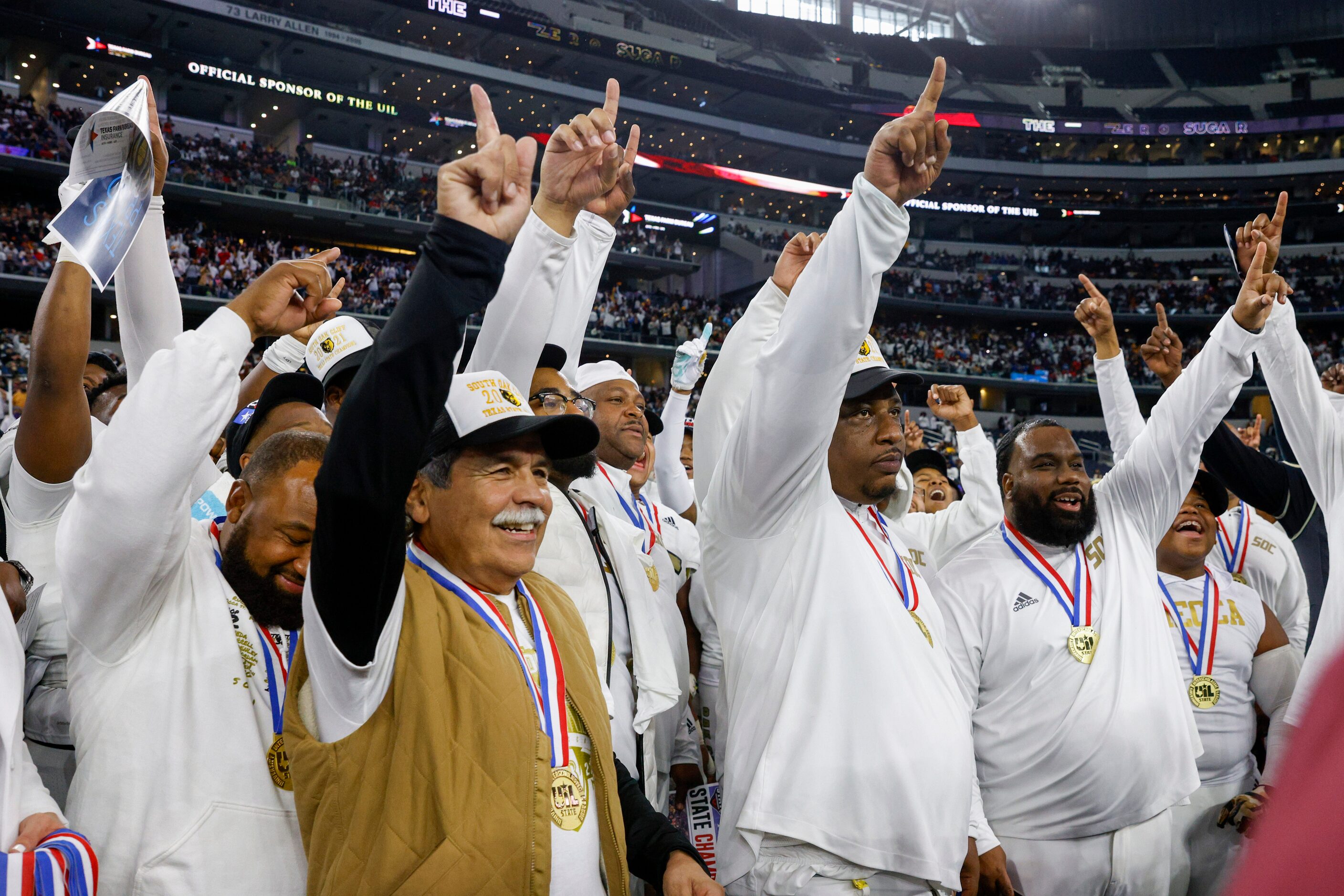 Dallas ISD Superintendent Michael Hinojosa (left) and South Oak Cliff head coach Jason Todd...