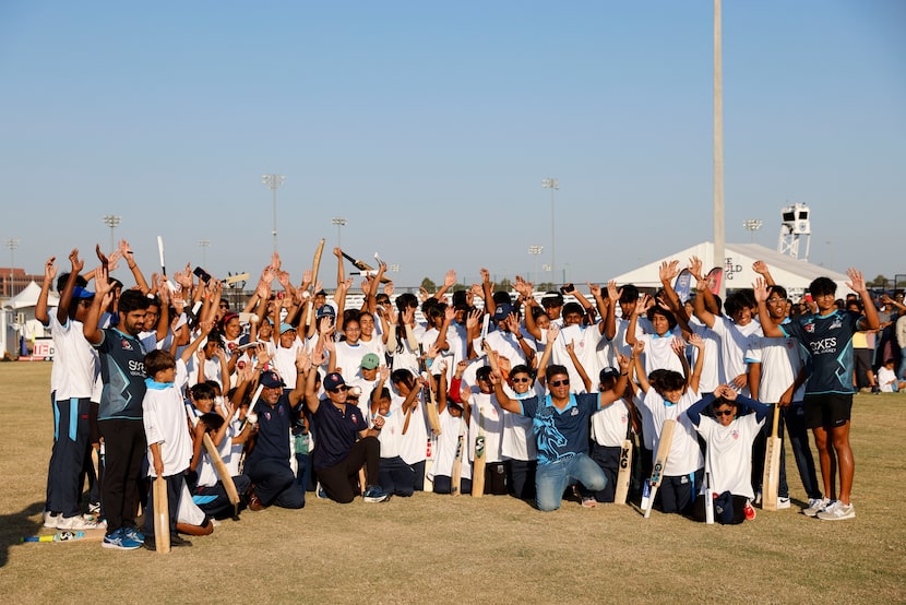 Cricket legend Sachin Tendulkar, poses for a photo with young cricketers, on Sunday, Oct....