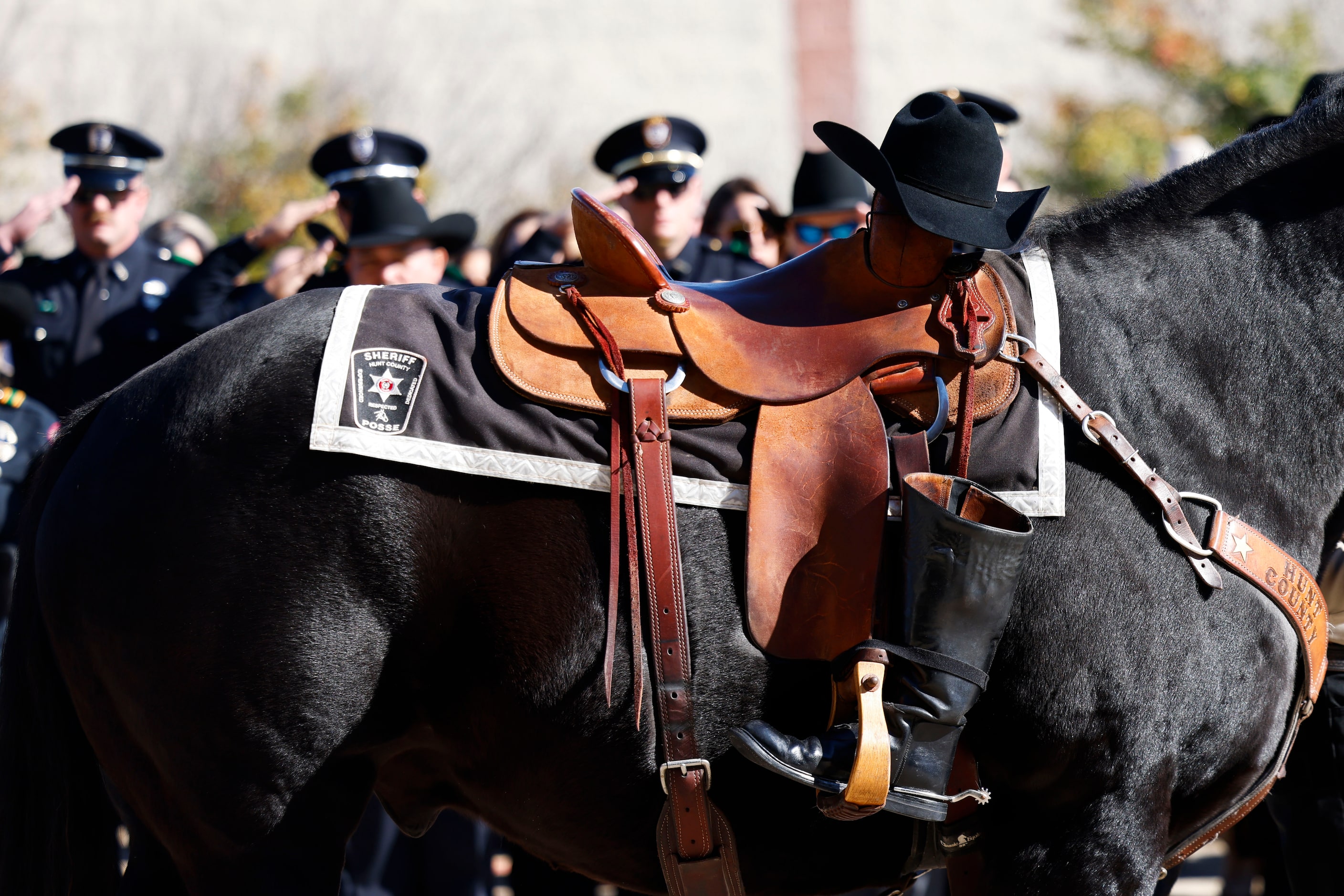 Belongings of fallen Greenville police officer Cooper Dawson are escorted on horseback...