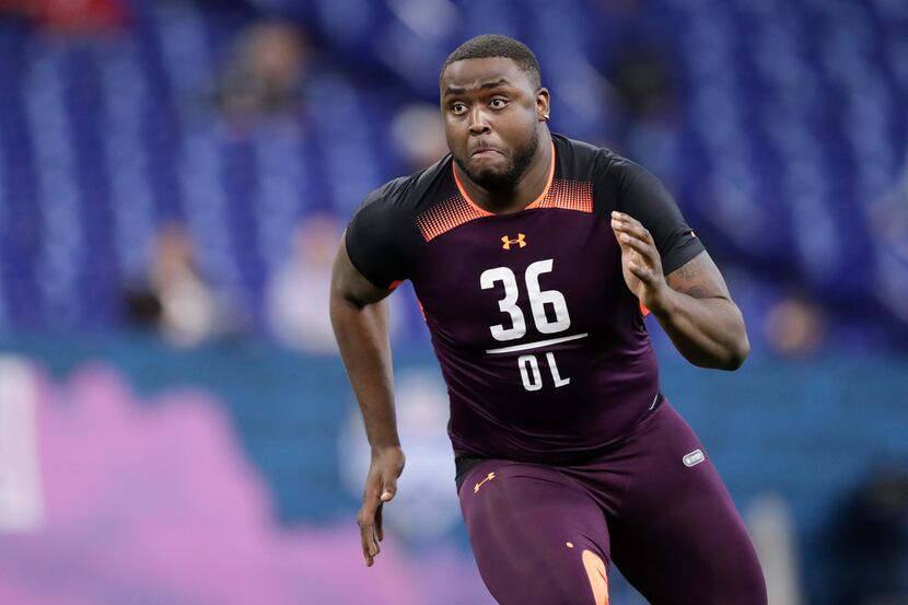 Ole Miss offensive lineman Greg Little runs a drill at the NFL football scouting combine in...