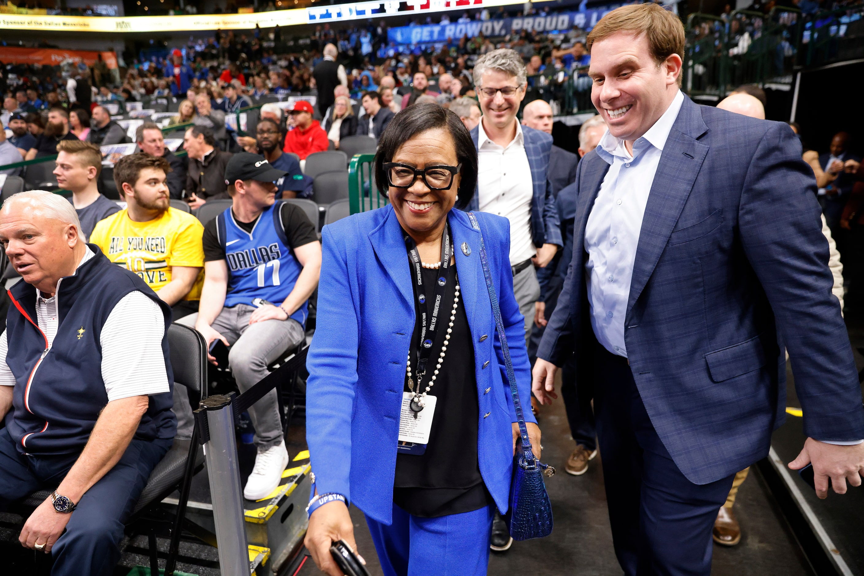 Dallas Mavericks new governor and majority owner Patrick Dumont (right) is led to the court...