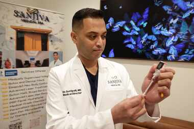 Dr. Praveen Guntipalli, who runs Sanjiva Medical Spa, works with a vial of compounded...