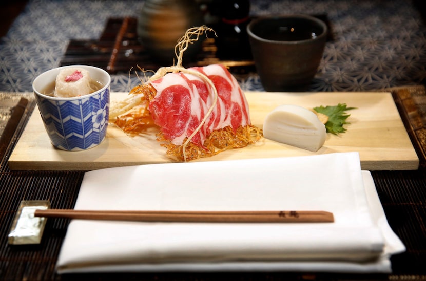 The first course, from left: dashi with fried soba dumpling, tatami iwashi with lamb...