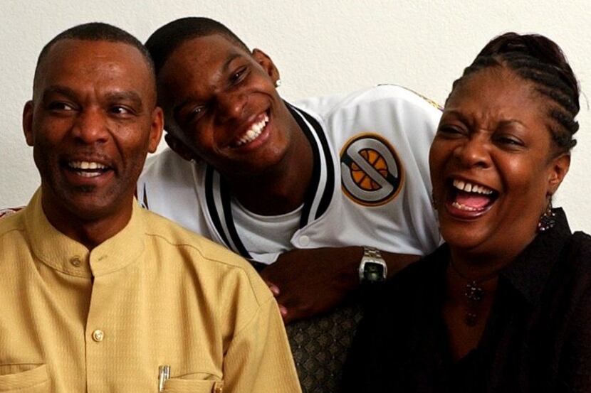 NBA draft prospect Chris Bosh (center) shares a laugh with his parents Noel (left) and...
