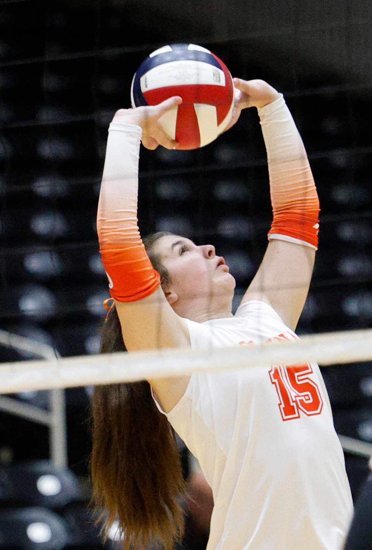 Celina's Alex Farrow (15) sets the ball during a UIL class 4A volleyball state semifinal...