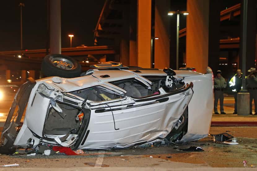  A white Chevy Tahoe carrying four people went off an overpass on the George H. Bush...