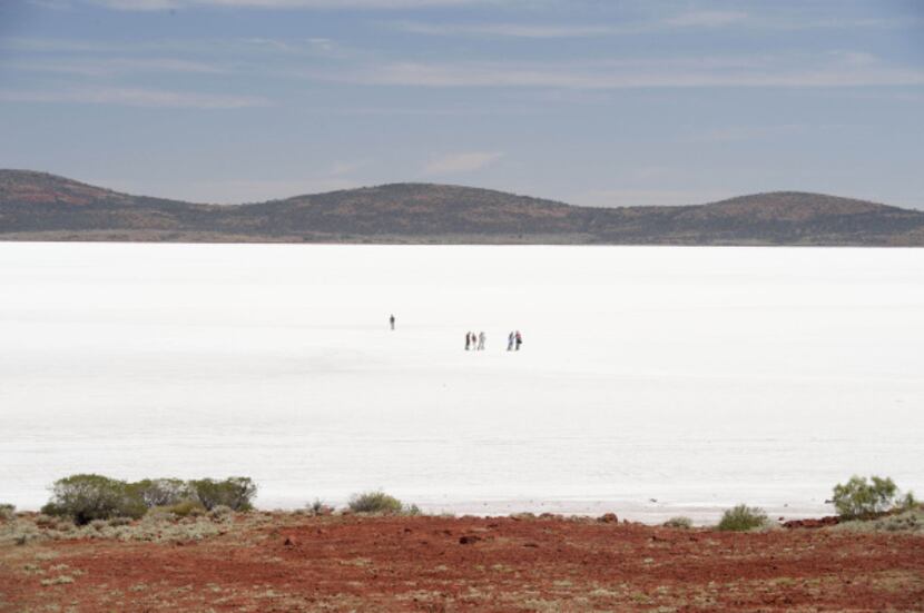 Visitors are quickly lost in the vastness of South Australia's Lake Gairdner whose flat,...