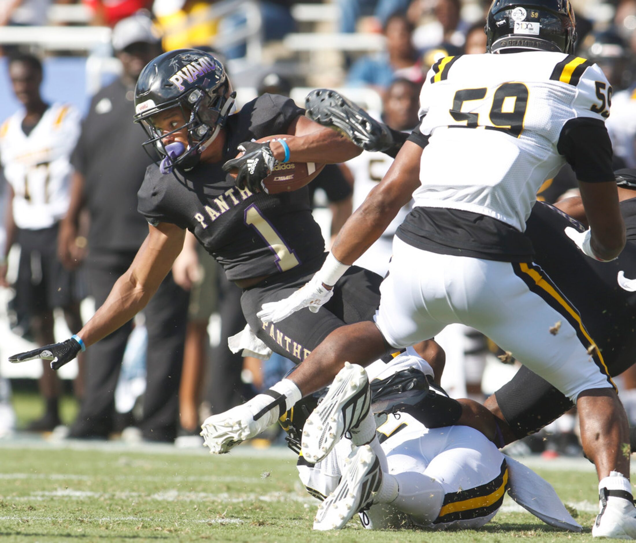 Prairie View running back Dawonya Tucker (1) spins for extra yardage against the Grambling...