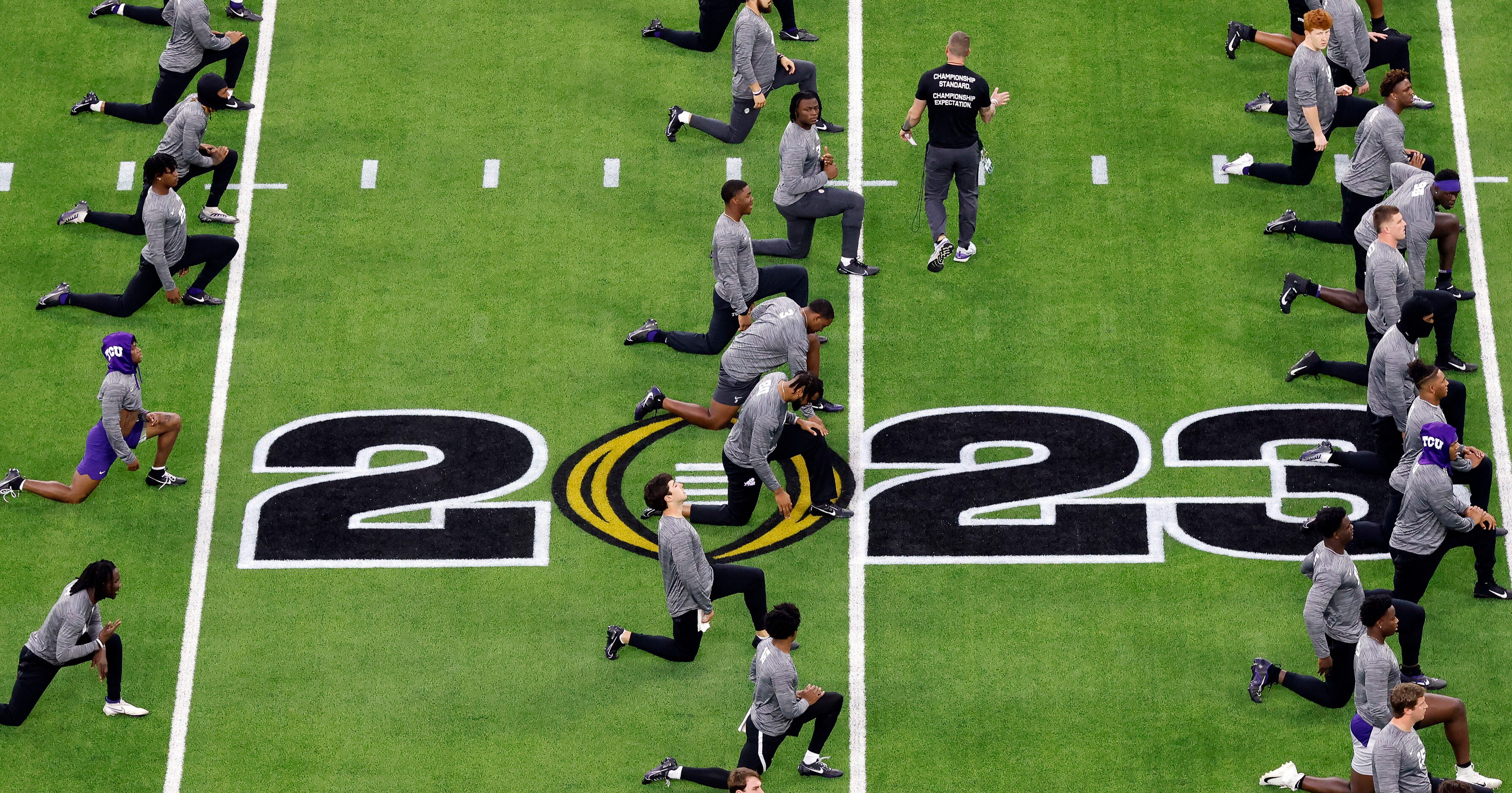 The TCU Horned Frogs football players warm up before facing the Georgia Bulldogs for the CFP...