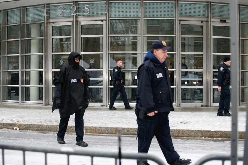 Members of Homeland Security Service patrol outside the U.S. Federal Courthouse after a...