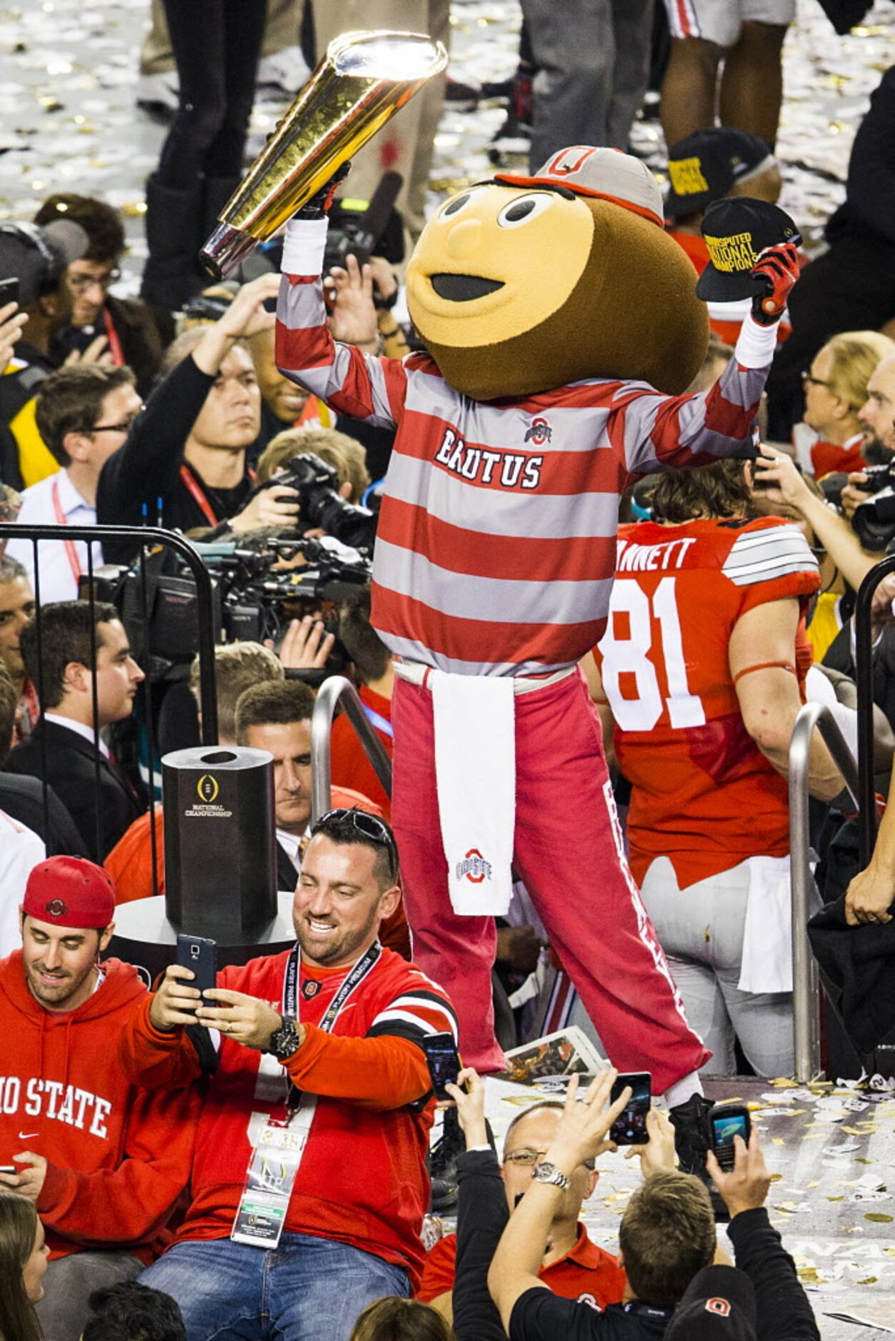 Ohio State mascot Brutus lifts the trophy as the Buckeyes celebrate after a victory over the...