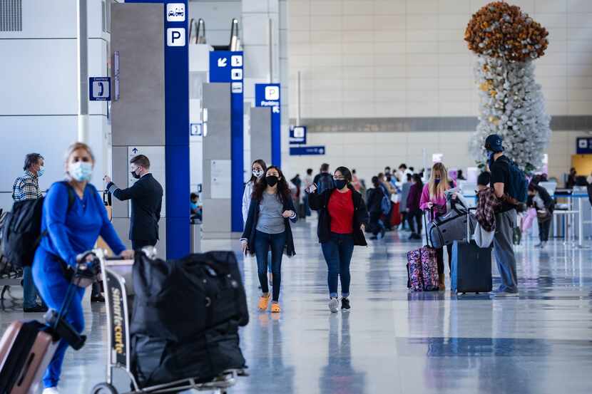 Travelers at Terminal D the day before Thanksgiving at DFW International Airport on Nov. 25.