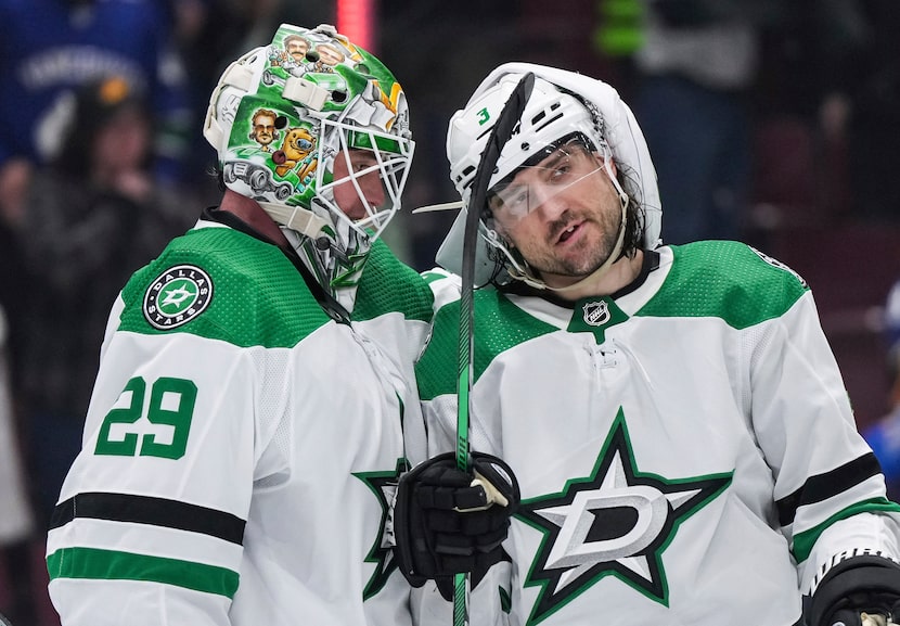 Dallas Stars goalie Jake Oettinger (and) Chris Tanev celebrated the team's win over the...