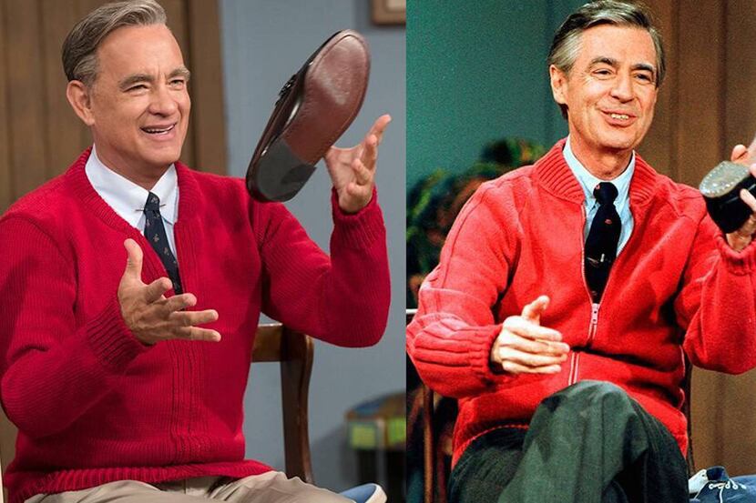 Actor Tom Hanks in a red sweater tossing a shoe as children's entertainer Fred Rogers for...