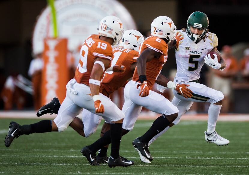 Baylor Bears wide receiver Jalen Hurd (5) is tackled by Texas Longhorns defenders during the...