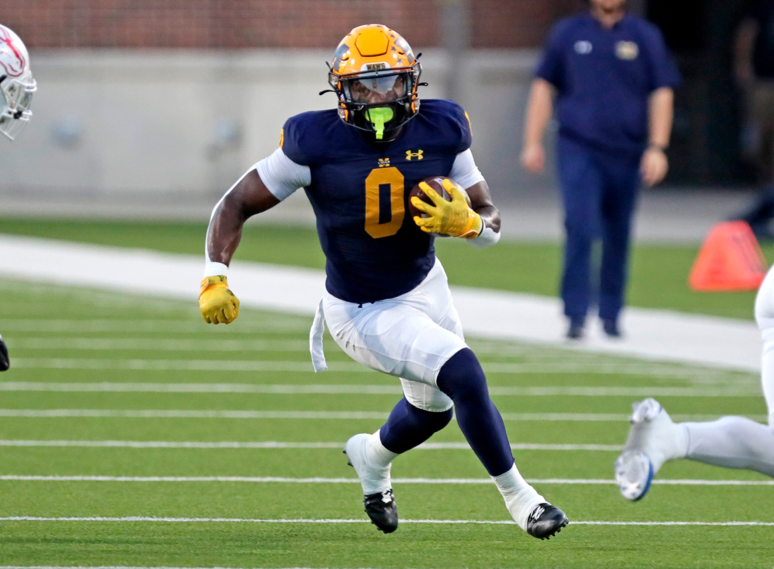 McKinney High School running back Makhi Frazier (0) carries the football during the first...