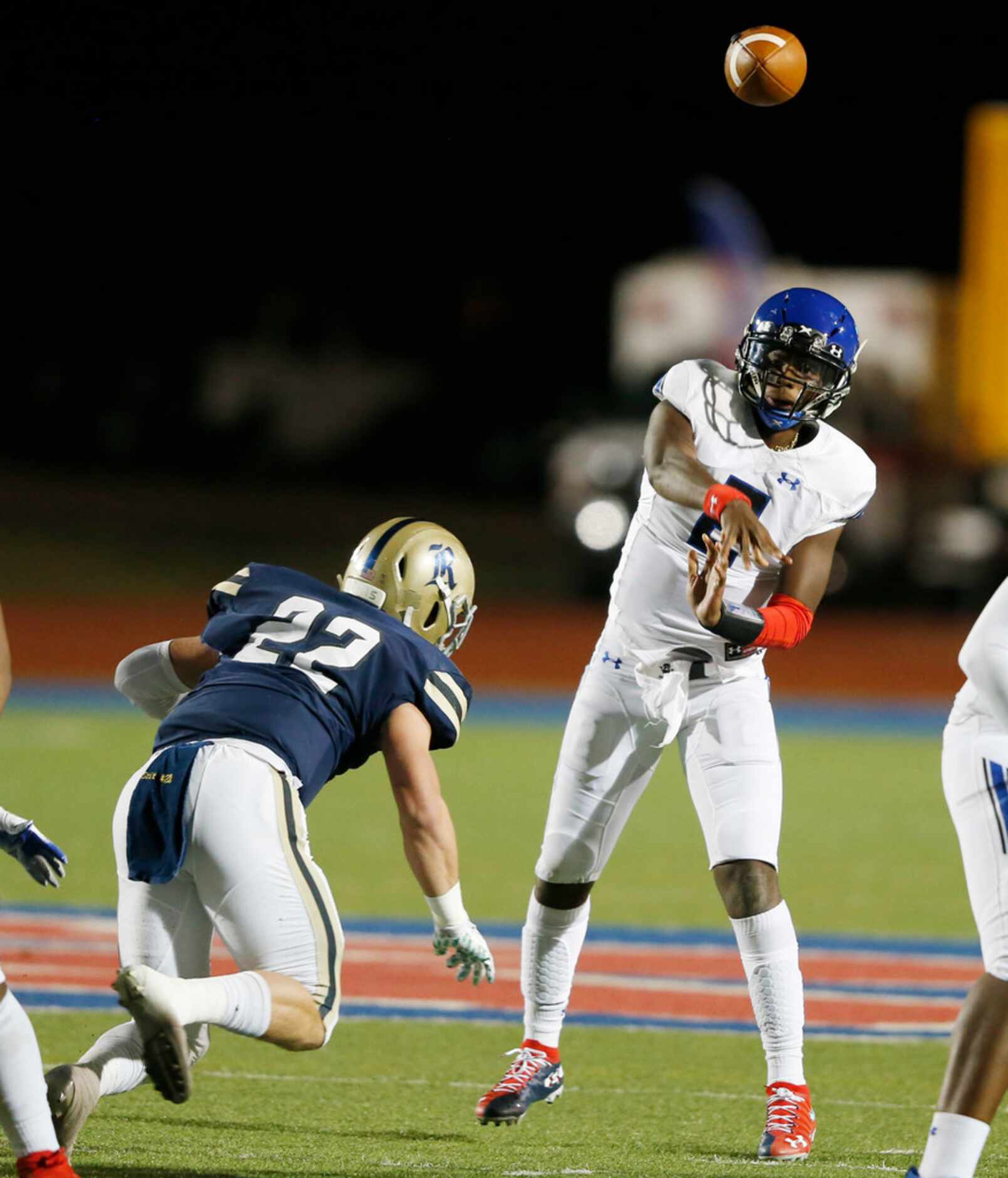 Trinity Christian's Shedeur Sanders (2) attempts a pass as 
Austin Regents Thomas Scully...