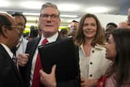 Labour Party leader Keir Starmer with his wife Victoria make their way through supporters as...