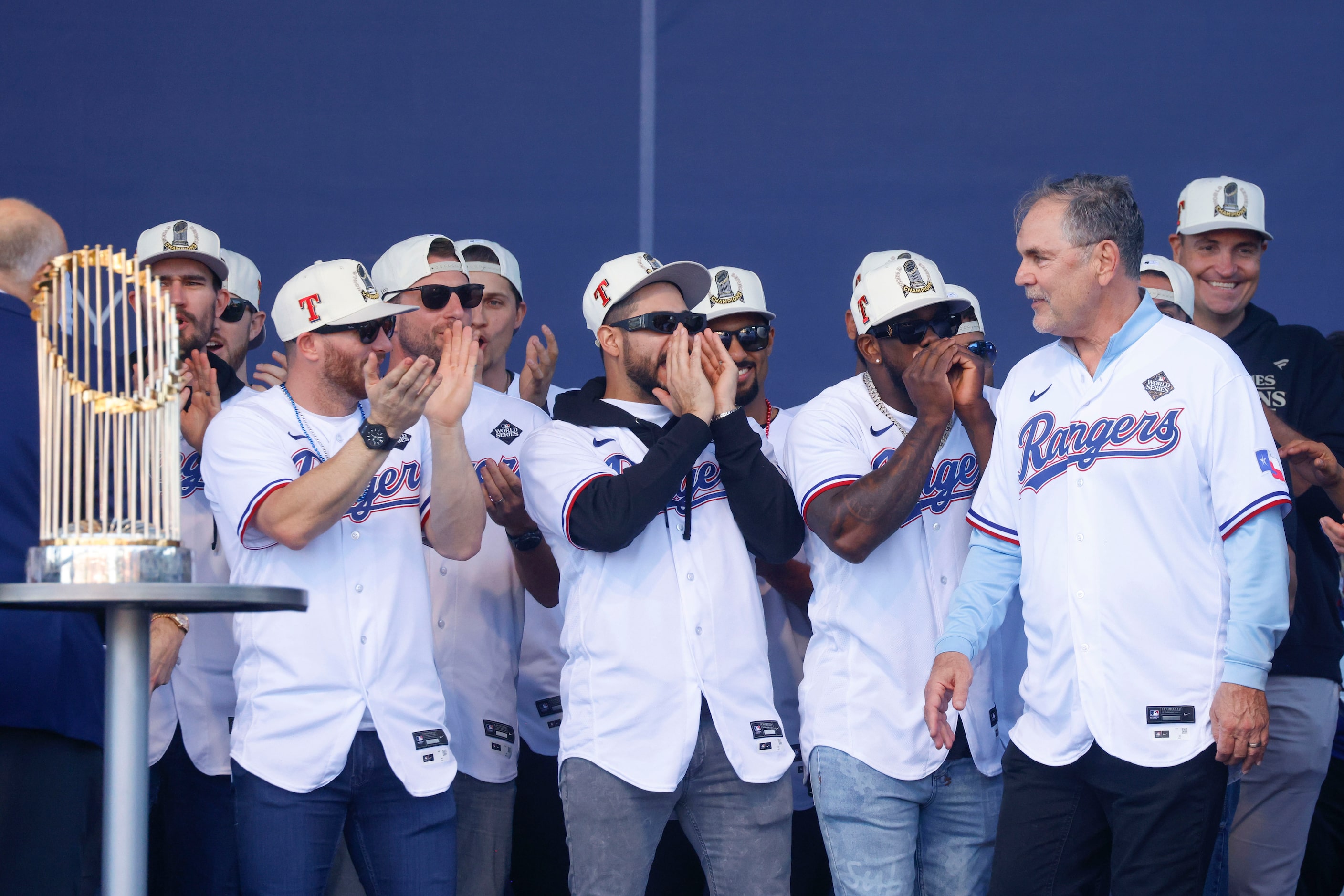 Texas Rangers cheer towards manager Bruce Bochy during Texas Rangers post-parade public...