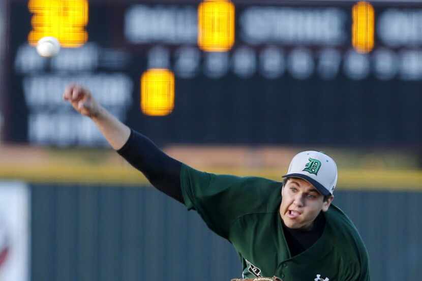 Southlake Carroll starting pitcher Matthew Canterino (20) throws  in the first inning of a...