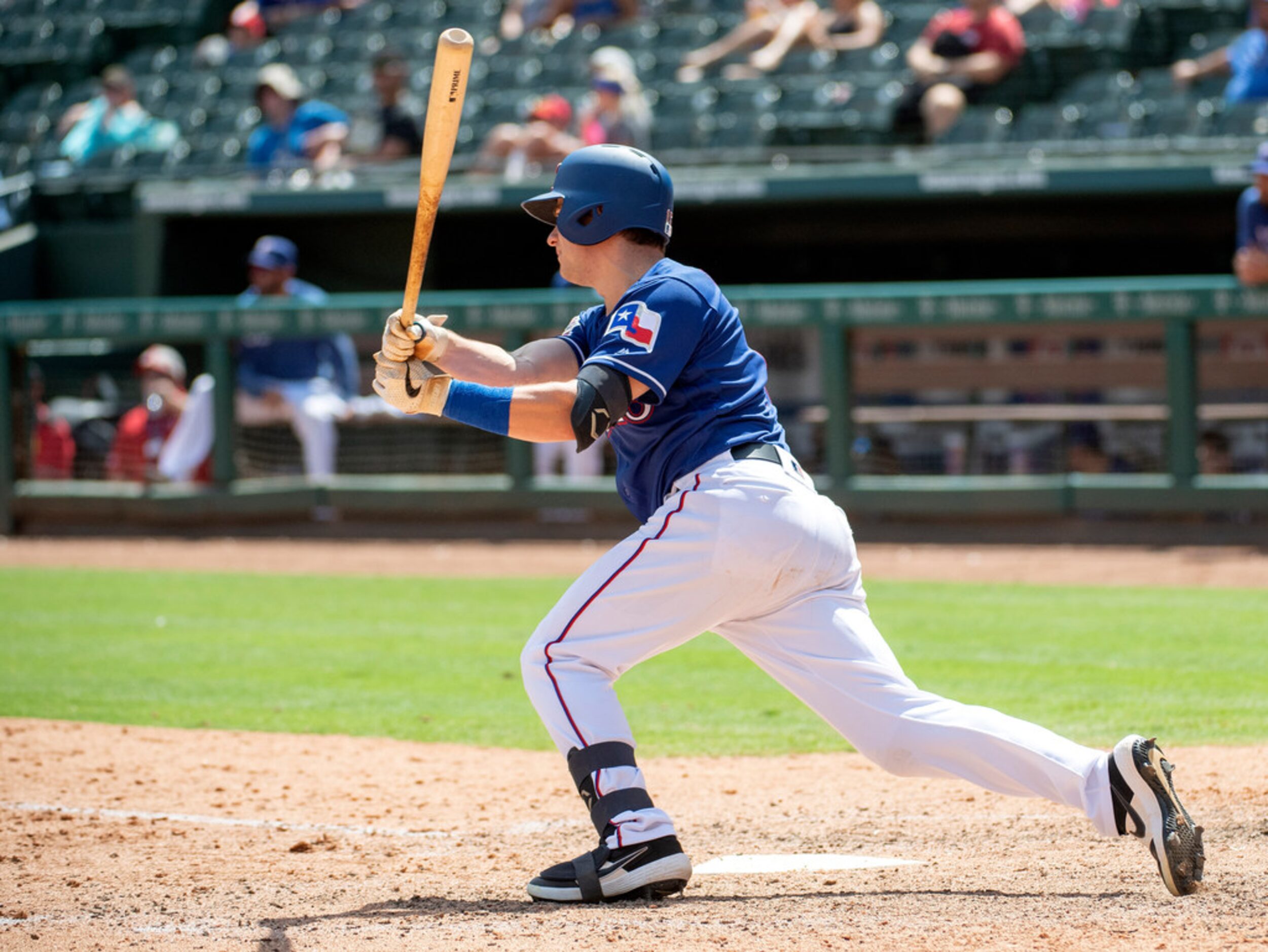 Texas Rangers' Nick Solak follows through on a single off of Los Angeles Angels starting...