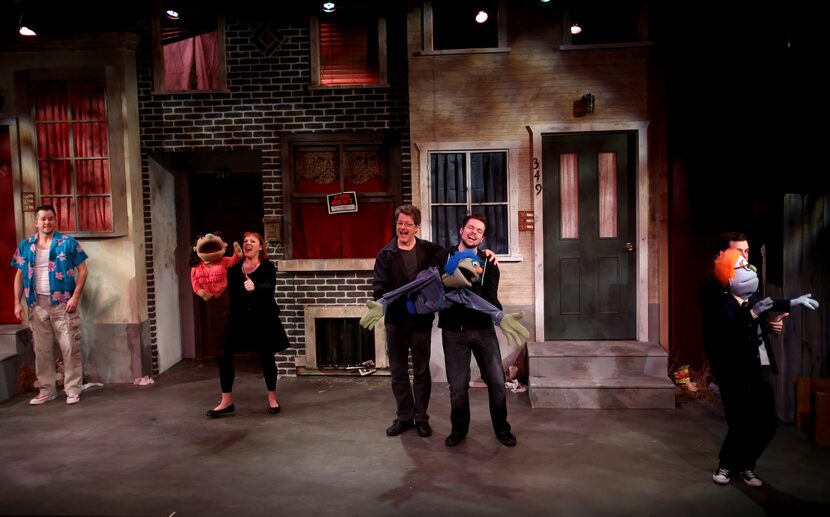 The cast of Avenue Q performs the opening number of Avenue Q on January 11, 2014 at Stage...