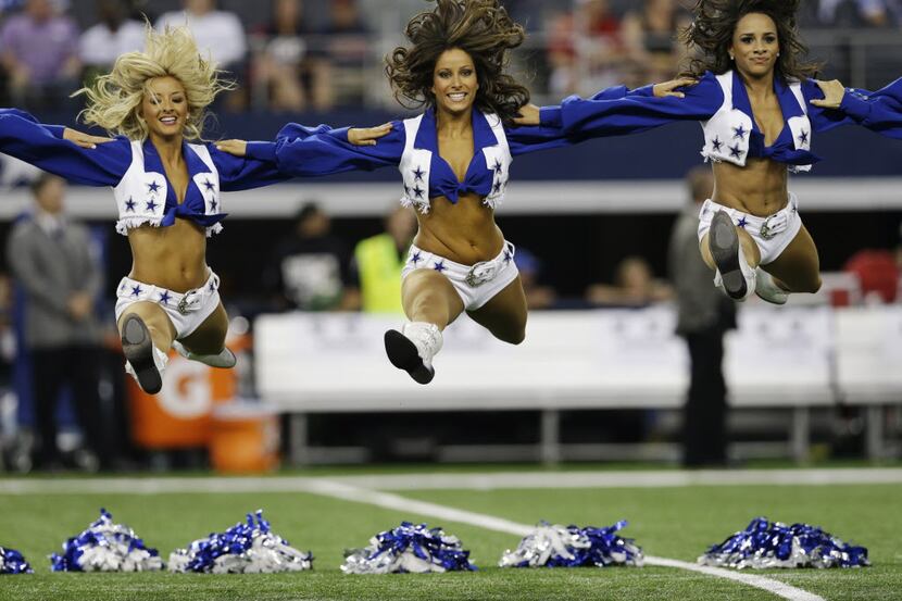 The Dallas Cowboys cheerleaders perform before a preseason NFL football game against the...