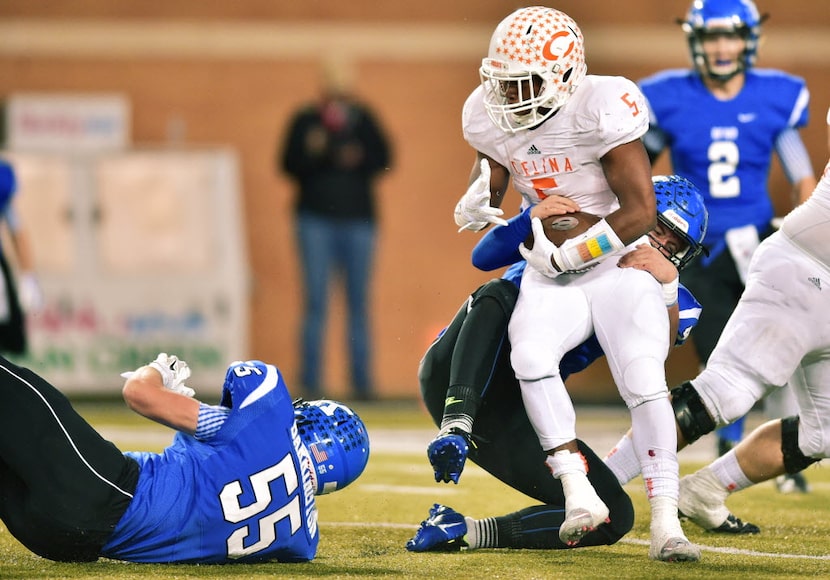 Krum junior linebacker Ryan Gipson (42) drags down Celina senior running back Jarren...