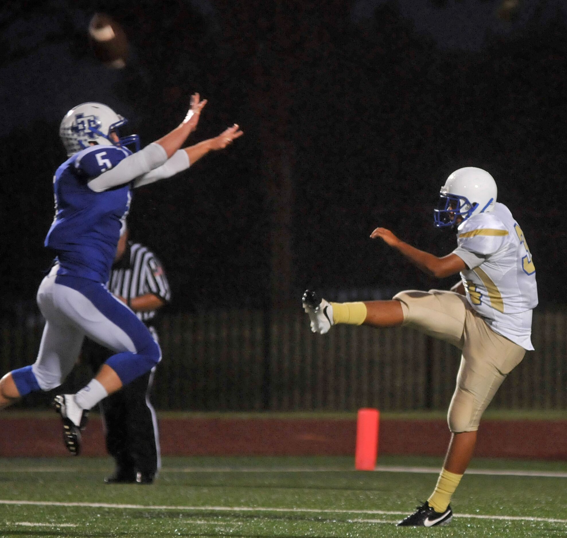 R.L. Turner senior Bryce Strickland (5) nearly blocks the punt of Conrad junior Humberto...