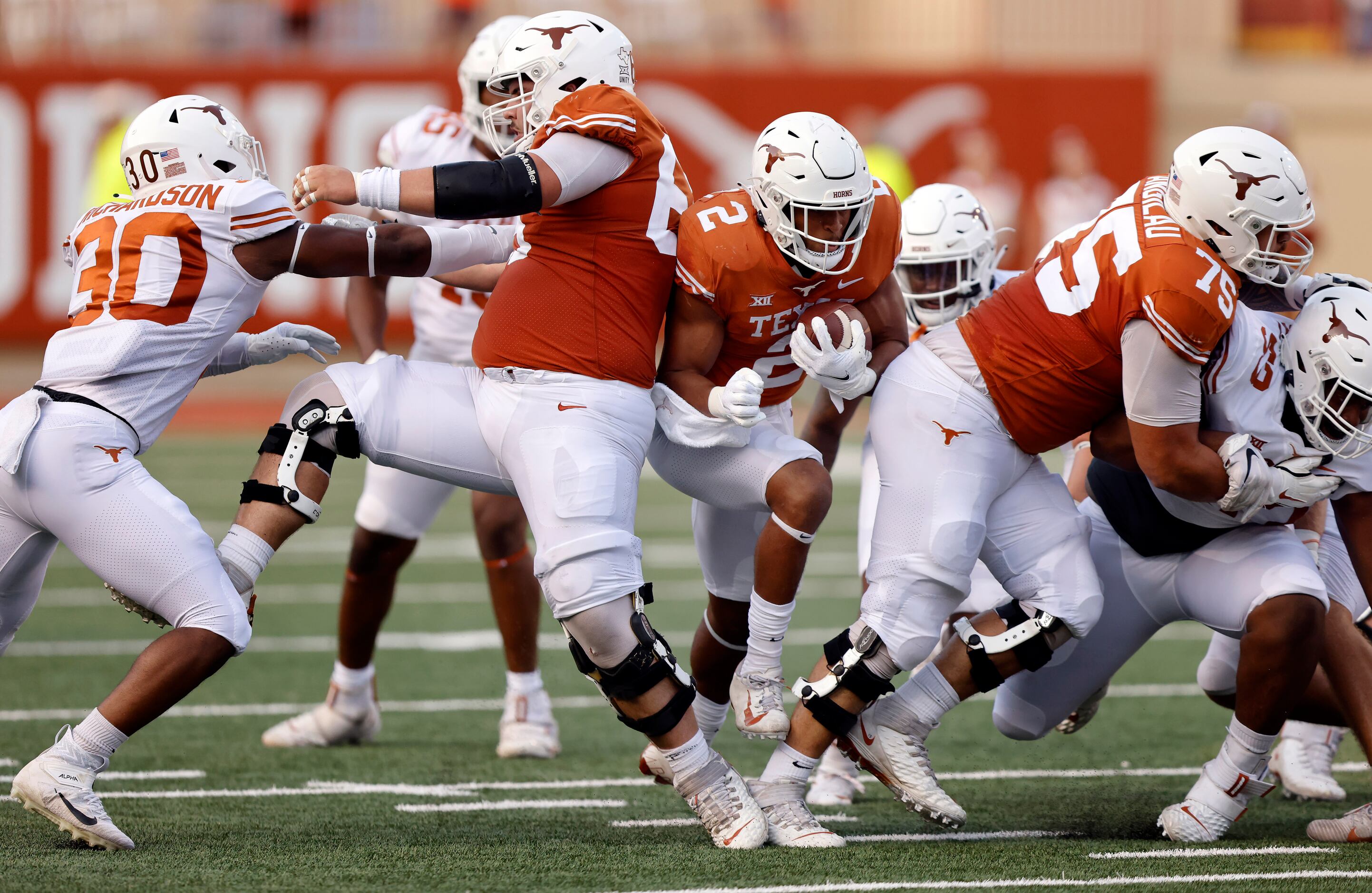 Texas Longhorns running back Roschon Johnson (2) breaks through the line enroute to a long...