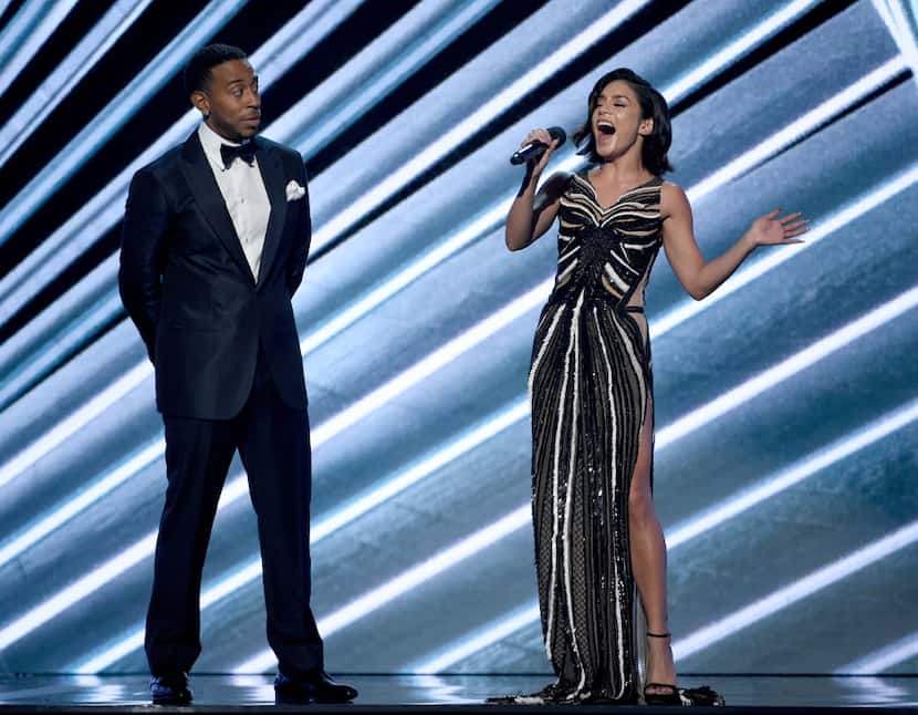 Ludacris, left, side eyes co-host Vanessa Hudgens at the Billboard Music Awards at the...