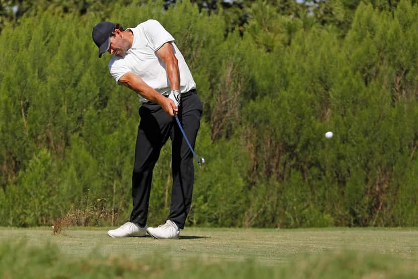 Former Dallas Cowboys quarterback Tony Romo hits his tee shot on No. 9 during a Web.com Tour...