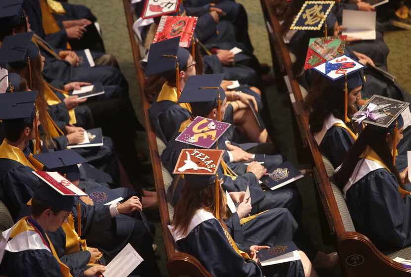 It's common for graduating seniors to decorate their caps with the logo of the college they...