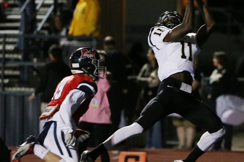 Plano East wide receiver Audie Omotosho (11) catches a touchdown in the end zone over...