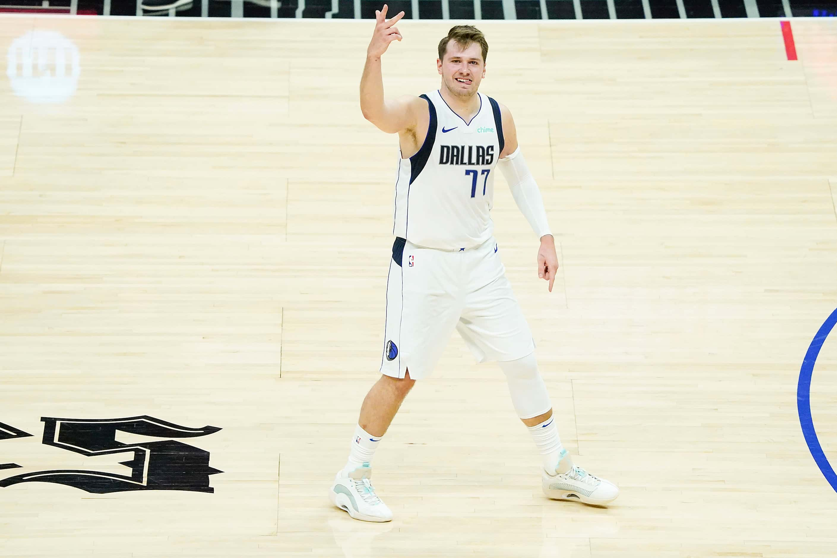 Dallas Mavericks guard Luka Doncic celebrates after hitting a 3-pointer during the third...