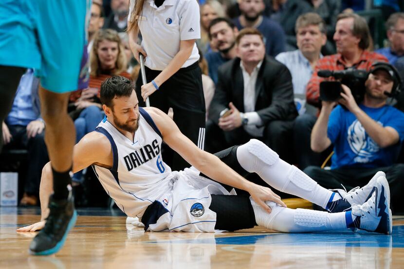 Mavericks center Andrew Bogut knew right away something was wrong with his right knee. Coach...