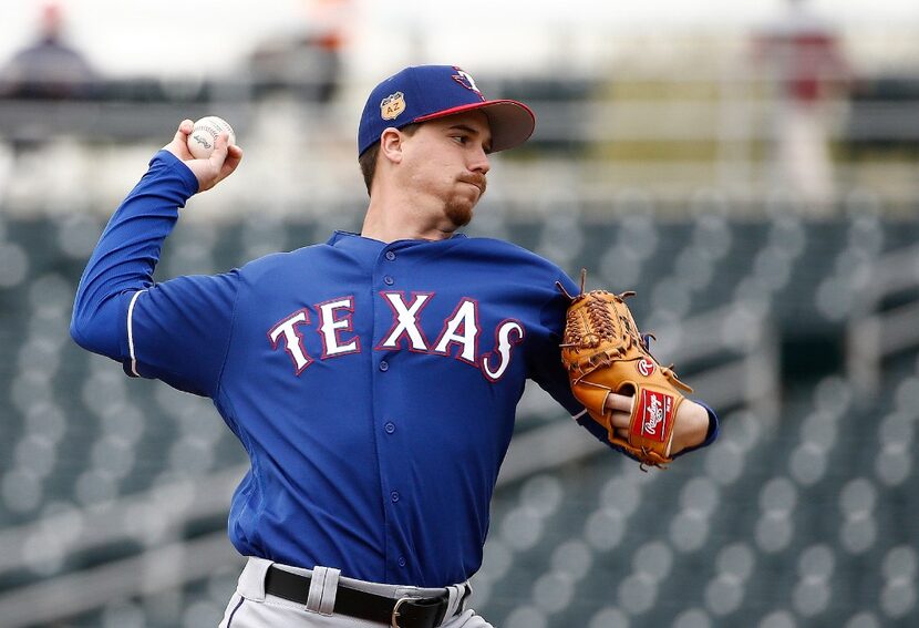 Texas Rangers starting pitcher Chi Chi Gonzalez throws a pitch against the Cleveland Indians...