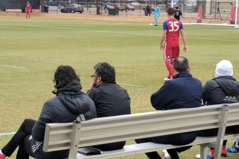 FC Dallas coaches, and Steve Cooke of OKC Energy (2nd from right) watch FC Dallas take on...