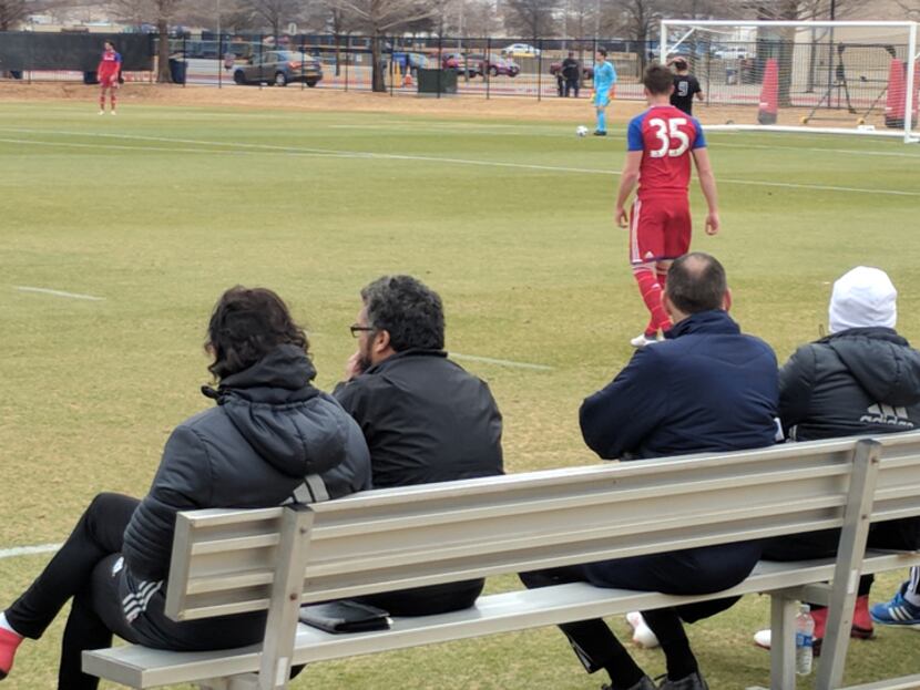 FC Dallas coaches, and Steve Cooke of OKC Energy (2nd from right) watch FC Dallas take on...