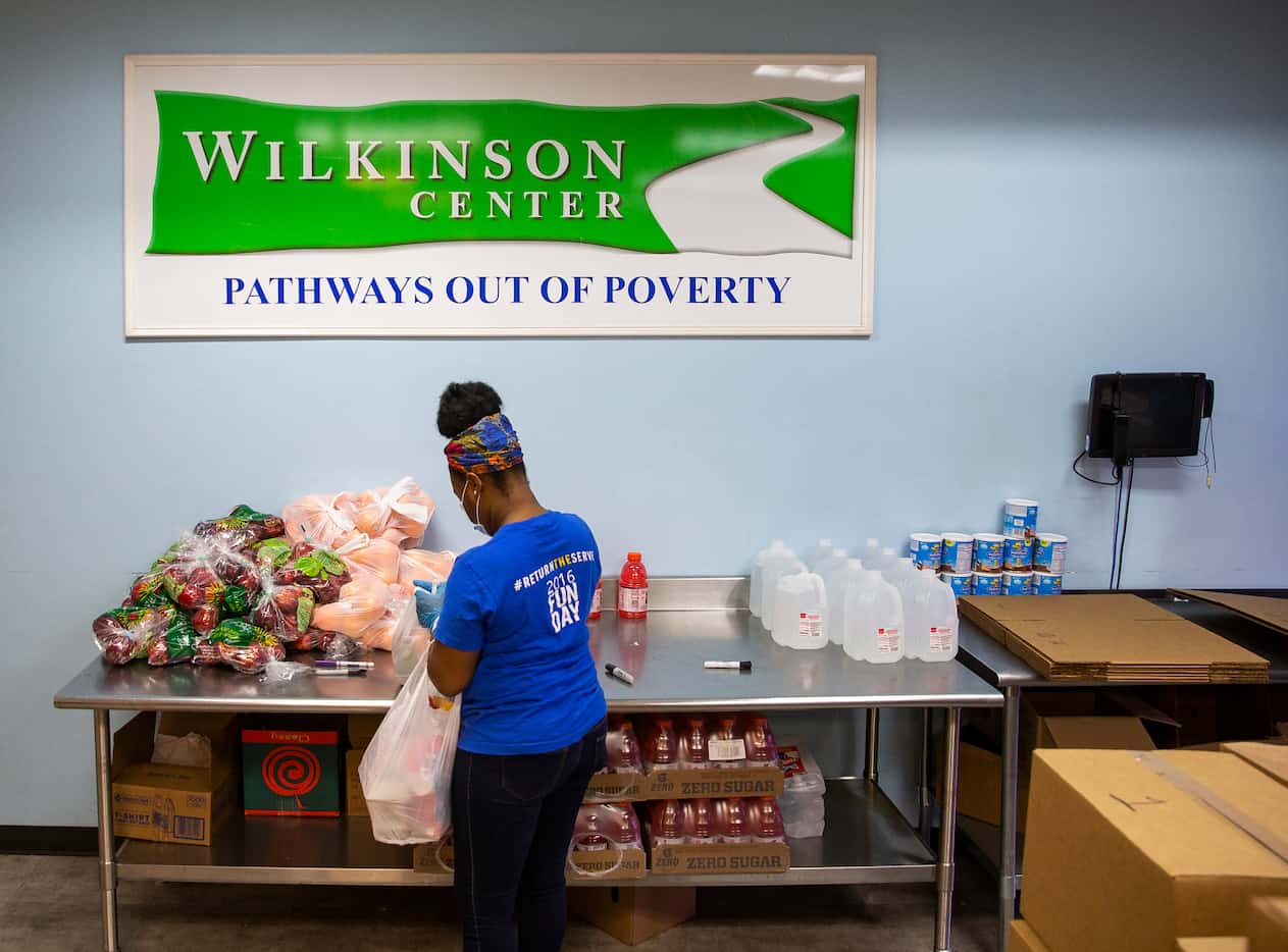 Get Shift Done worker Shkoryah Carthen prepares a bag of food at the Wilkinson Center on...