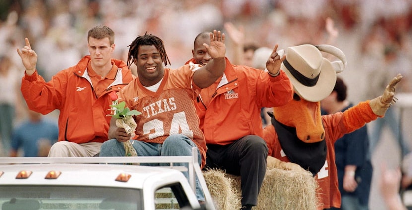 UT football star and Heisman trophy winner Ricky  Williams greets the crowds along Congress...