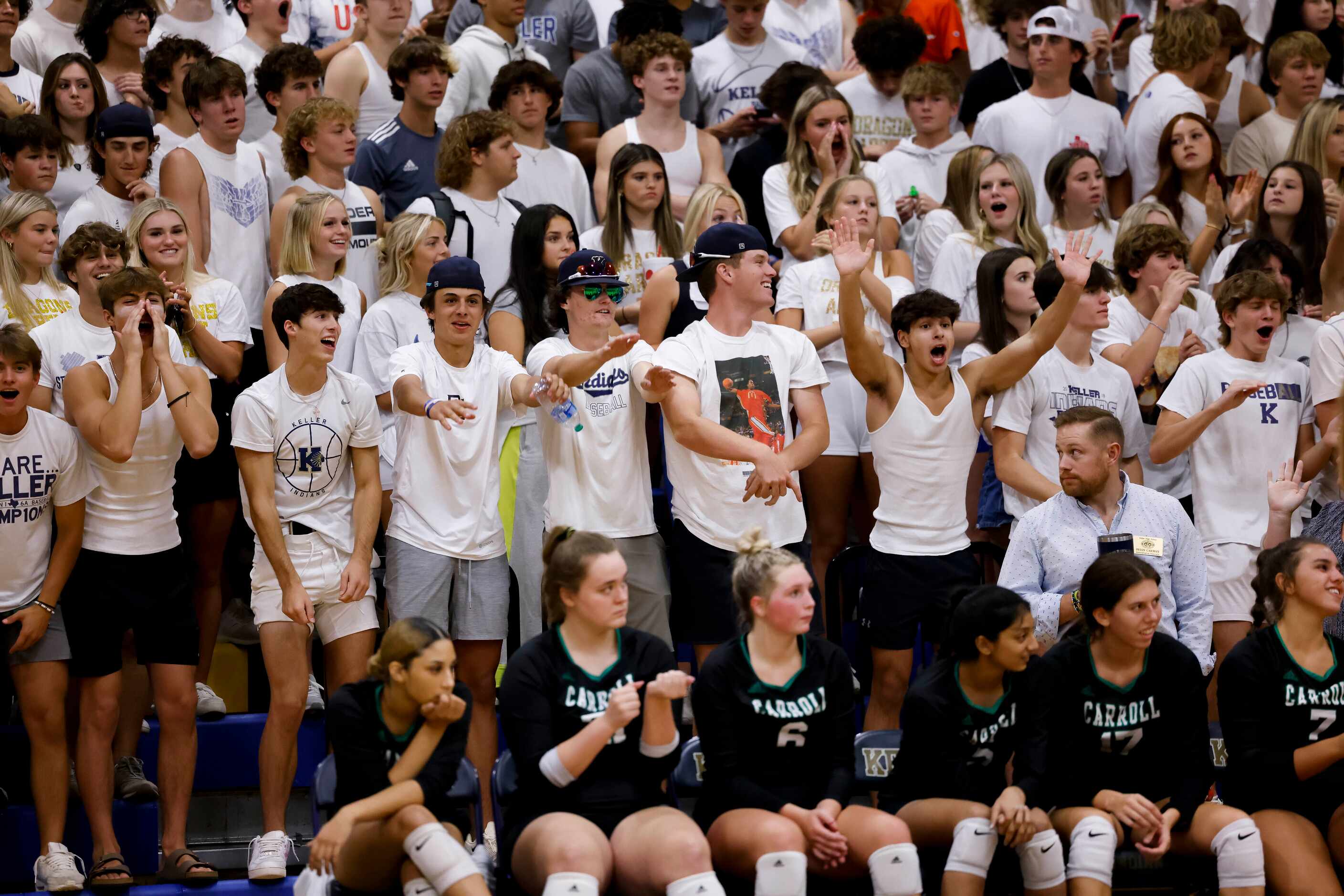 The Keller Student section cheer for their team against Southlake Carroll during the third...
