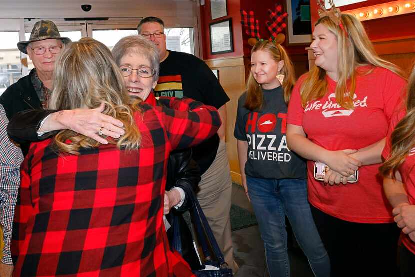 Robin Markle, 70, of Forney, received a hug from her niece Kelley Daniel, of Haslet, as...