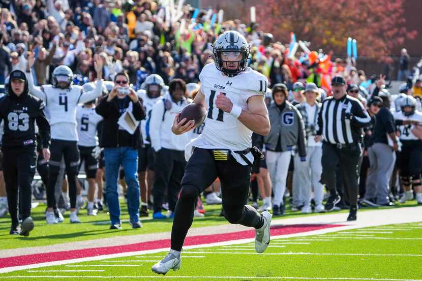 Denton Guyer quarterback Jackson Arnold (11) races down the sidelines on a 49-yard touchdown...