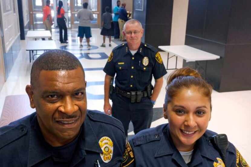 
Dallas school district police Officers Ricky Porter and Jessica Garcia, with Chief Craig...