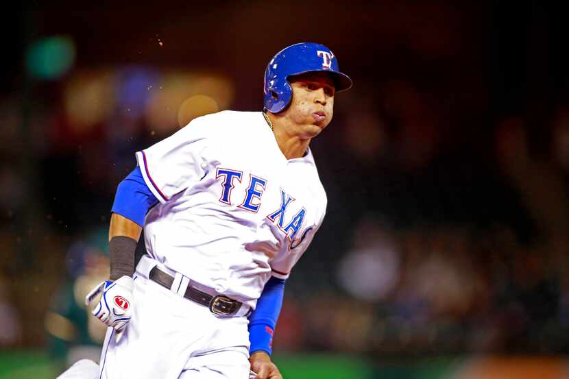 Apr 30, 2014; Arlington, TX, USA; Texas Rangers center fielder Leonys Martin (2) rounds...