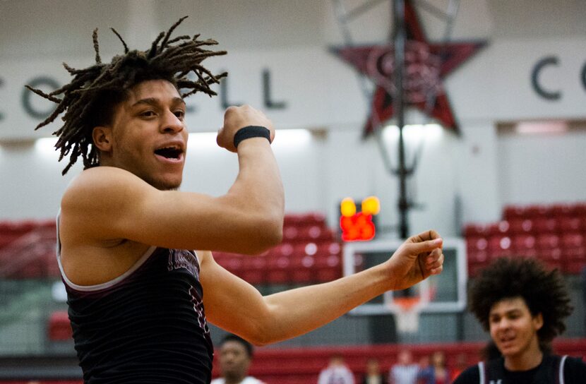 Mansfield Timberview guard Joey Madimba (0) celebrates after a dunk during the first quarter...