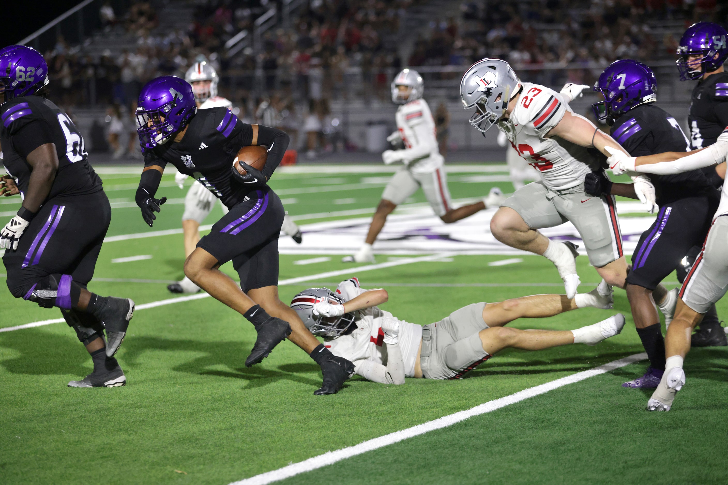 Anna player #4 Ashton Ansley breaks free from a tackle during the Lovejoy High School at...